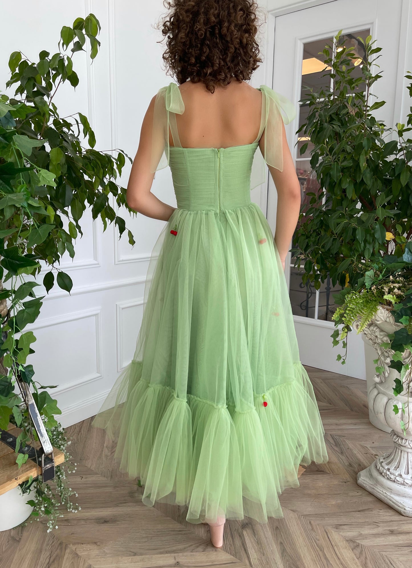 Green midi dress with bow straps and embroidered cherries
