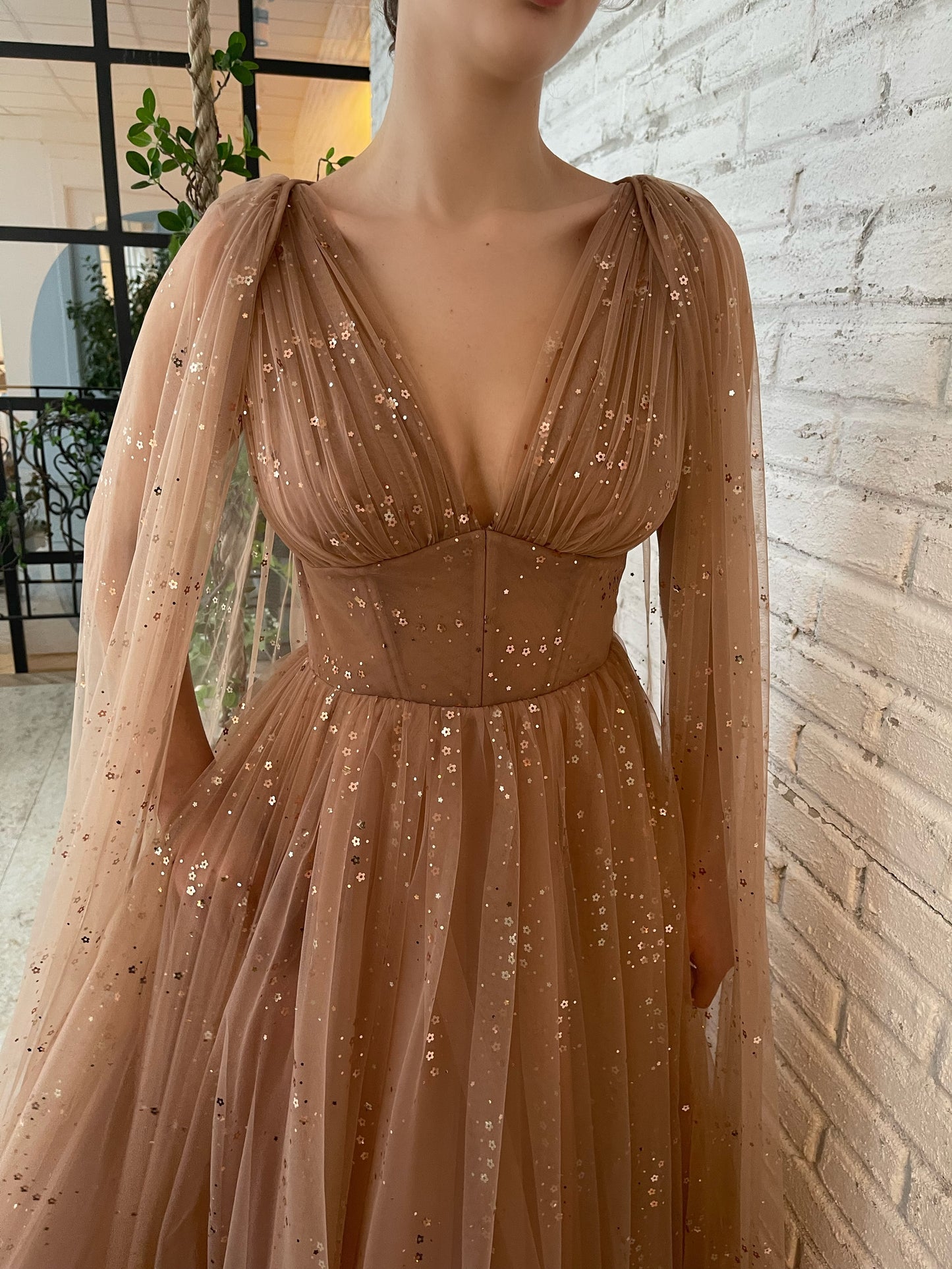 Brown A-Line dress with v-neck, cape sleeves and starry fabric