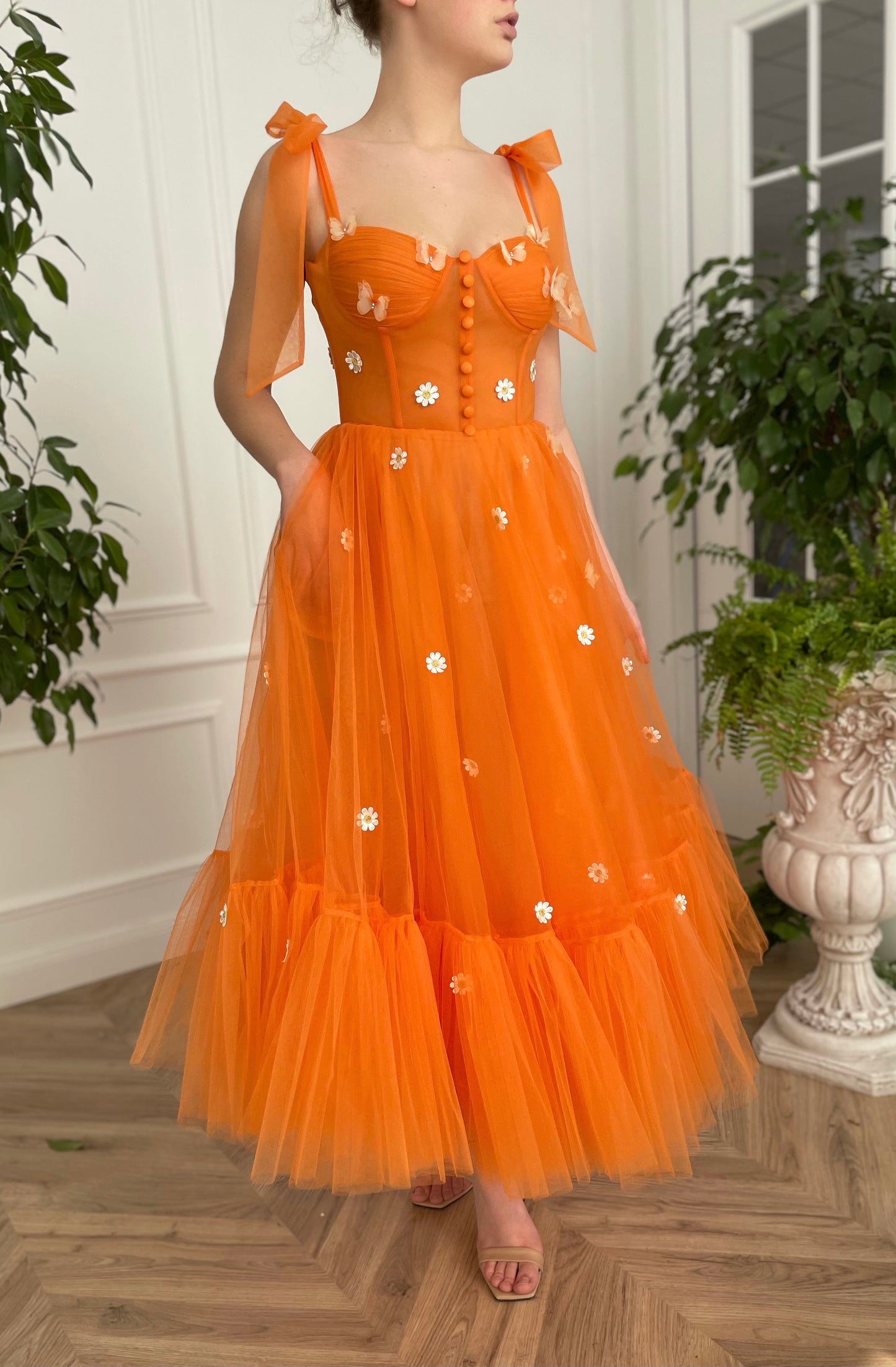 Orange midi dress with bow straps and embroidered daisies and butterflies