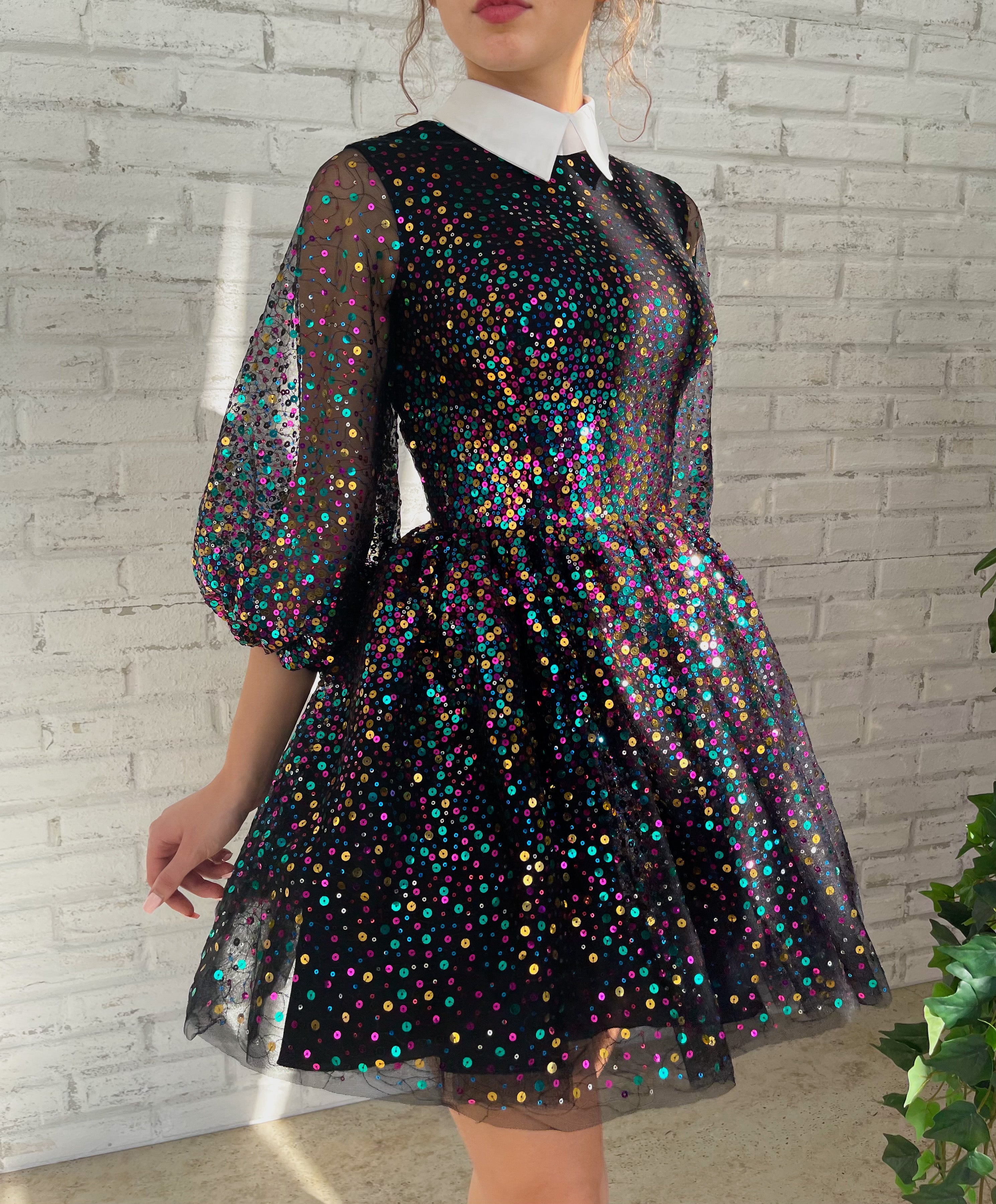 Black mini dress with sequins and short sleeves