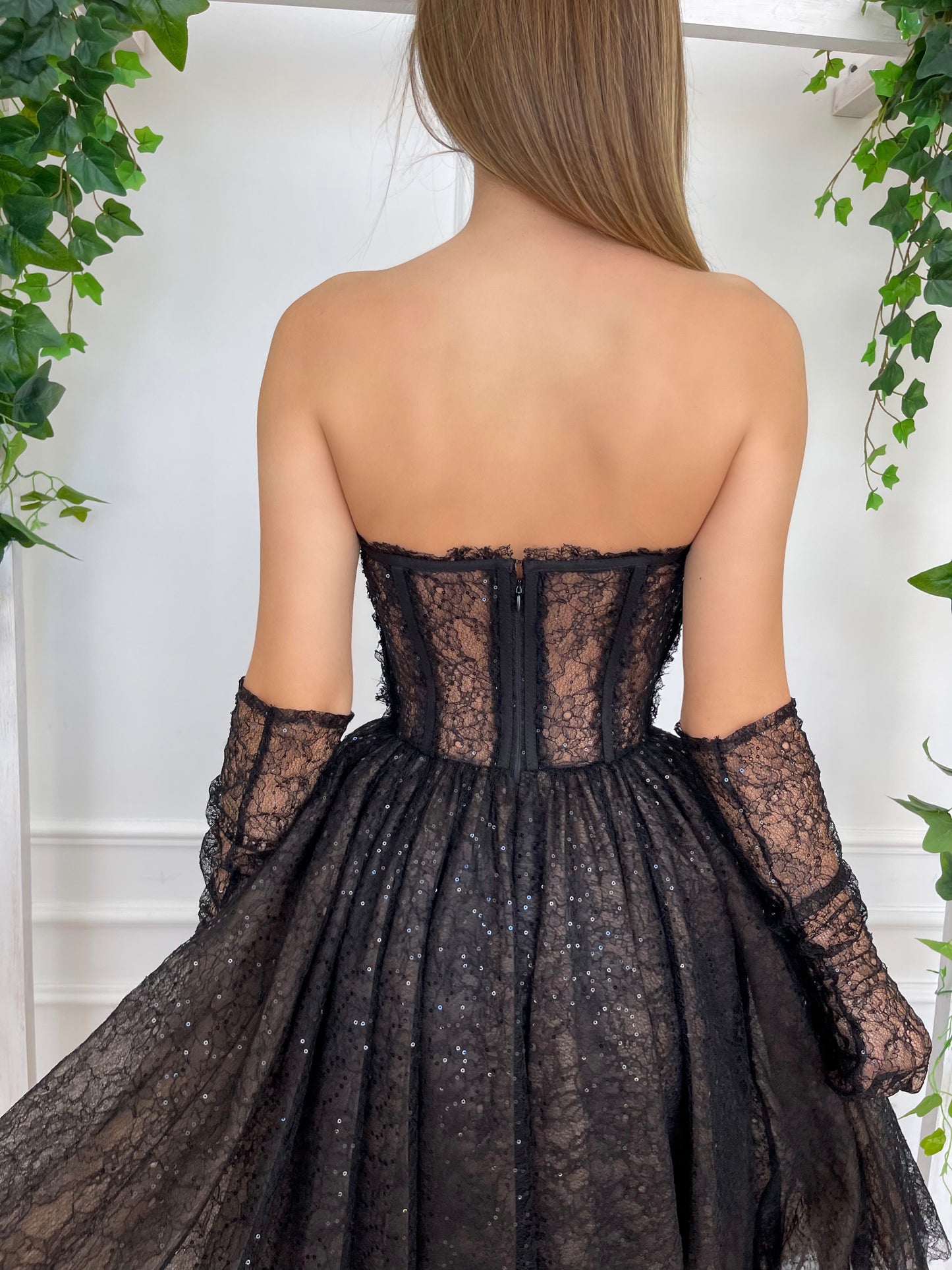 Black midi dress with no sleeves and gloves