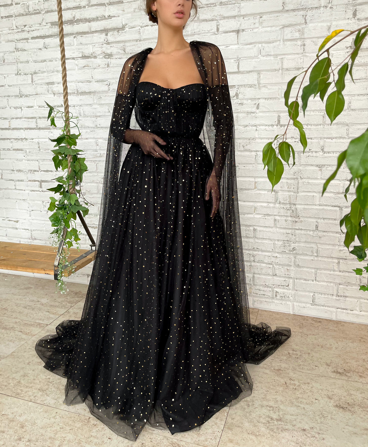Black A-Line dress with cape sleeves, gloves and starry fabric