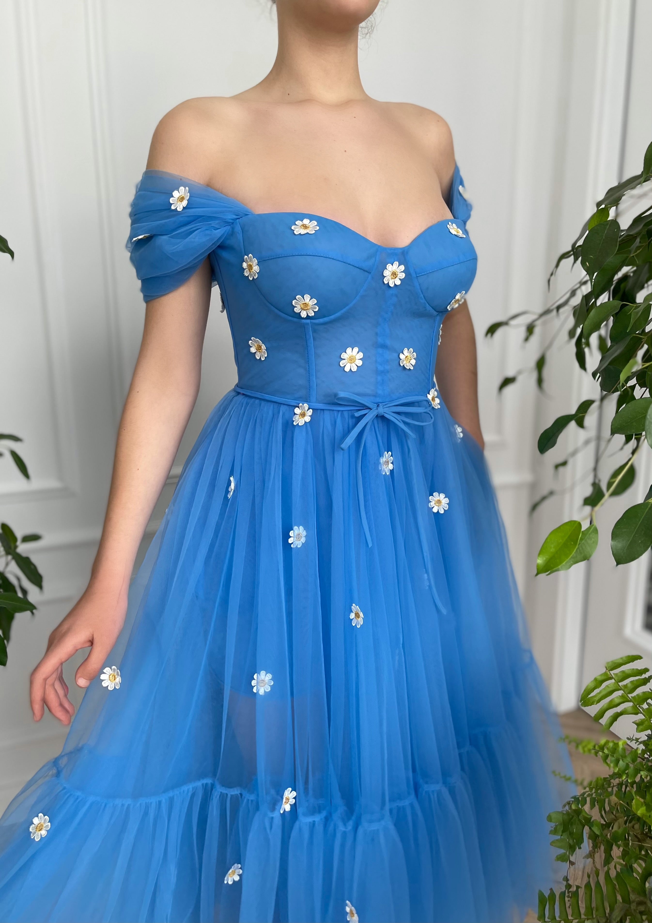 Blue midi dress with off the shoulder sleeves and embroidered daisies