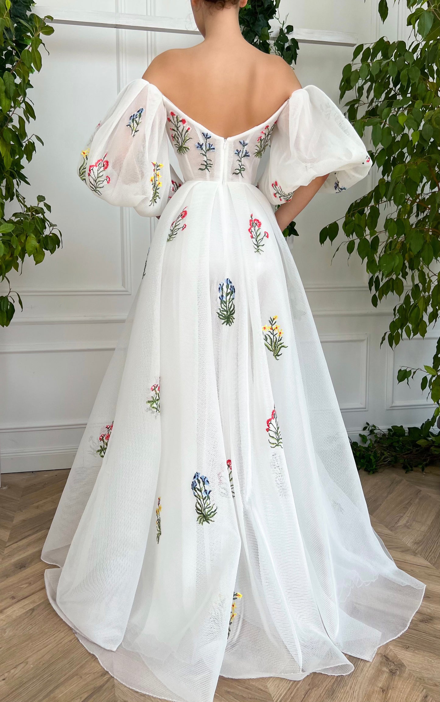 A line white bridal dress with embroidered flowers and off shoulder sleeves