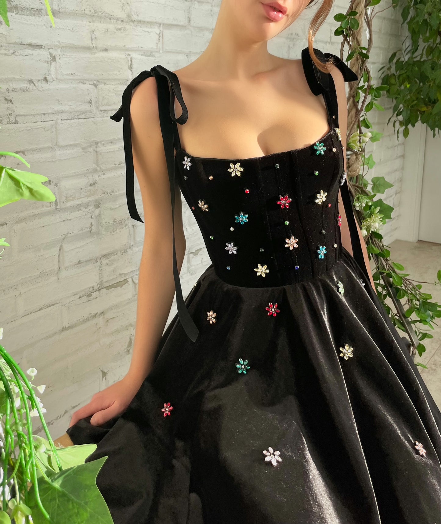Black mini dress with bow straps and embroidery
