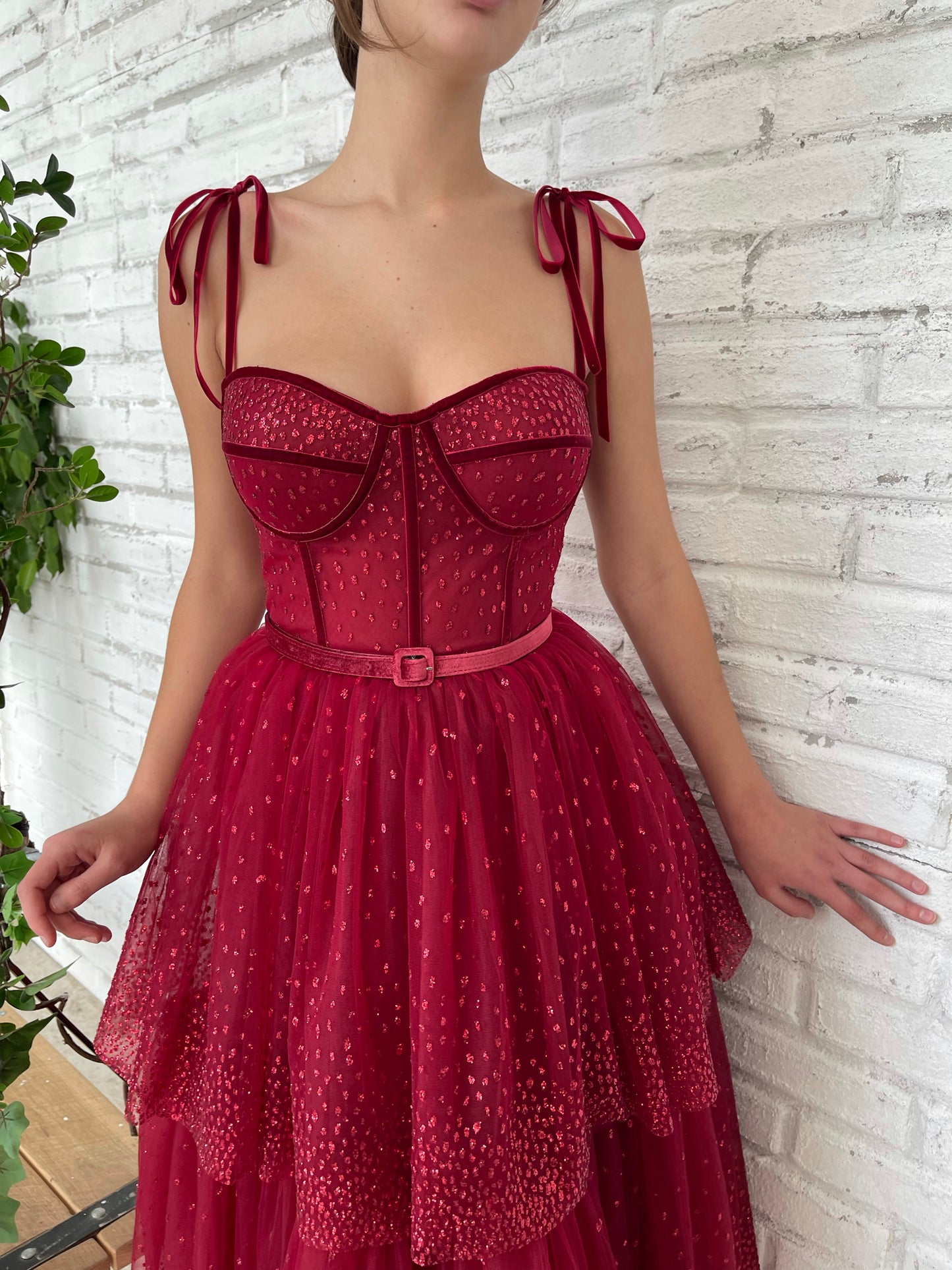 Red midi dress with spaghetti straps and belt