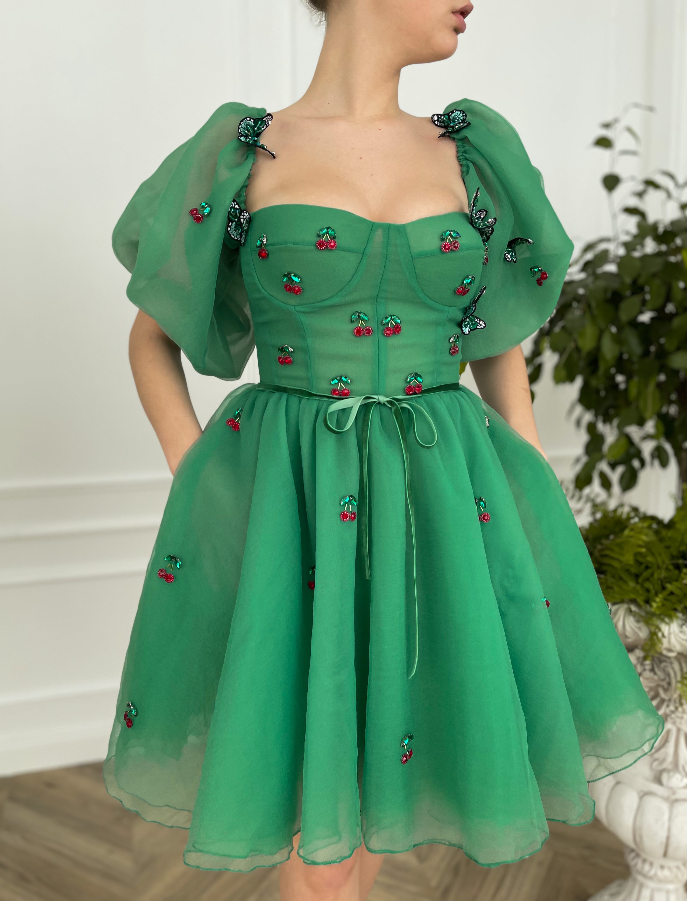 Green mini dress with embroidered cherries, butterflies and off the shoulder sleeves 