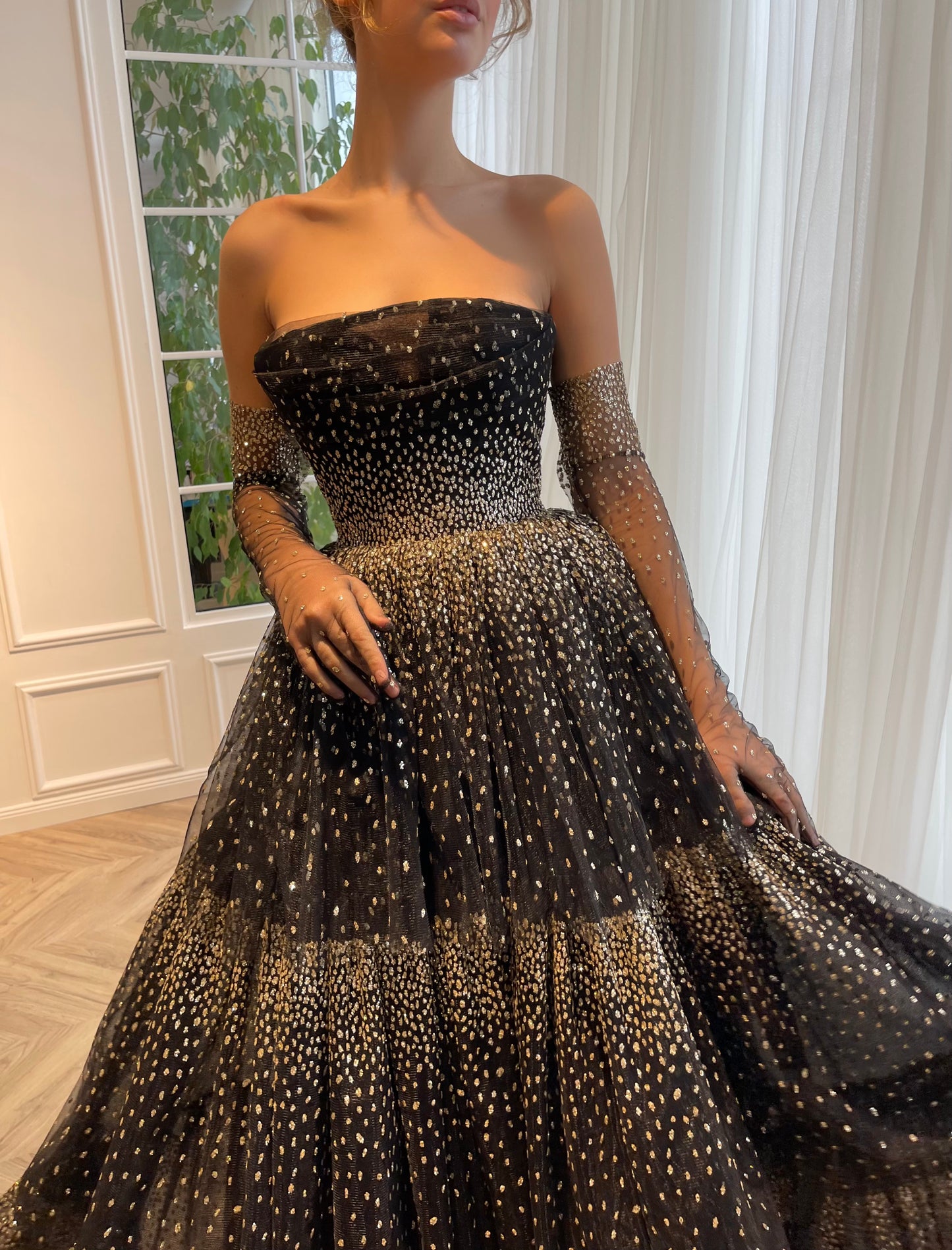 Black A-Line dress with no sleeves and gloves