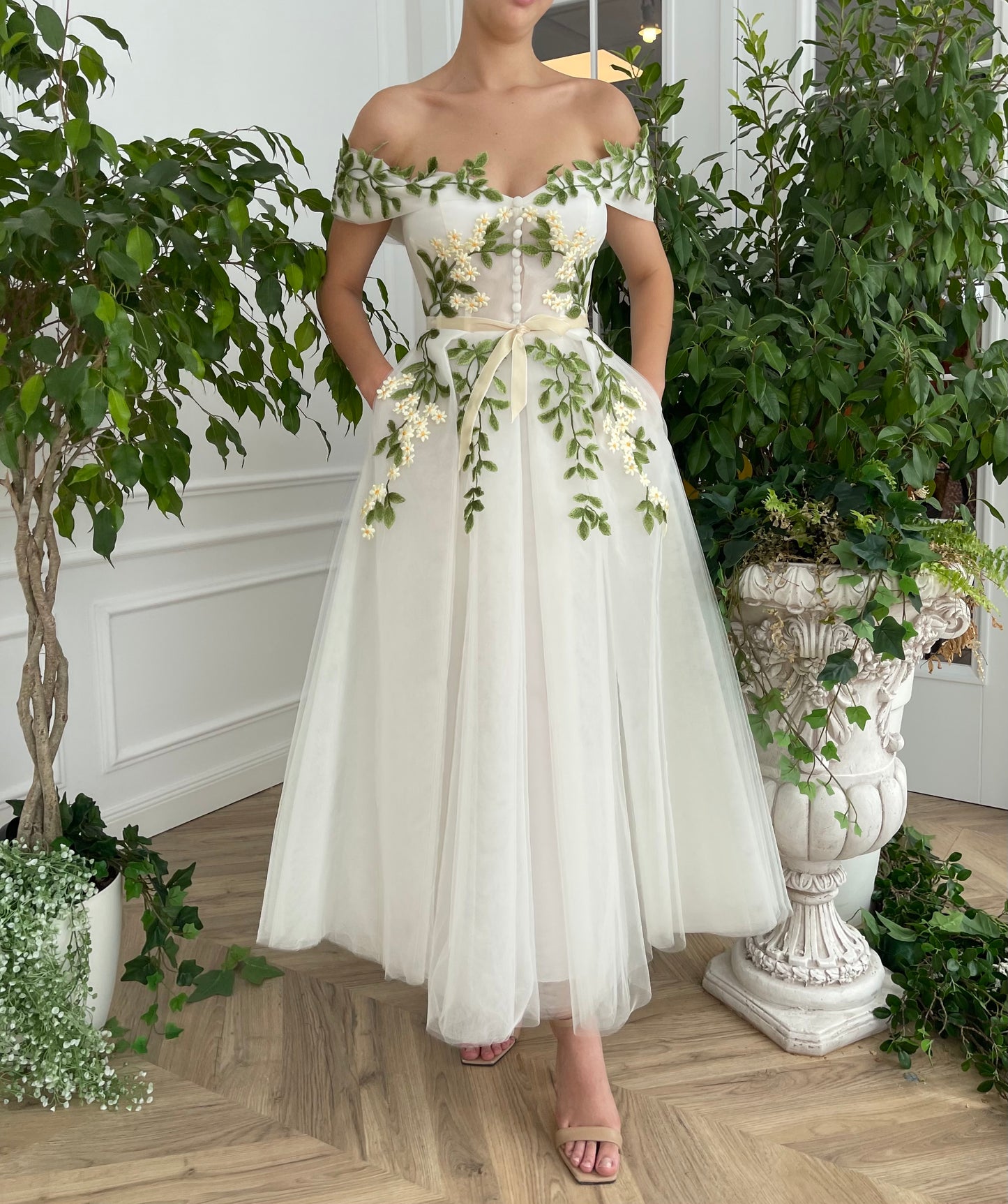 Midi white bridal dress with off the shoulder sleeves and embroidered vines and flowers