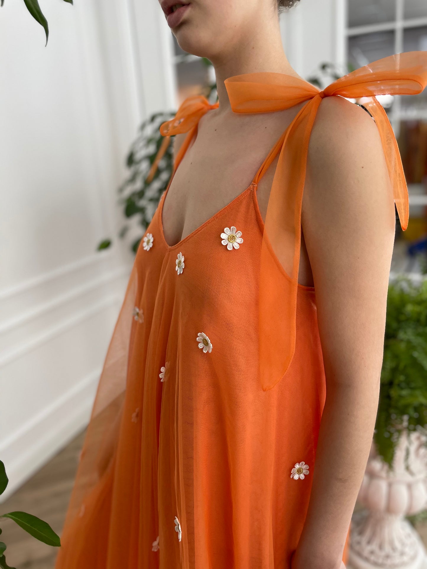 Orange sheath dress with embroidered daisies and bow straps