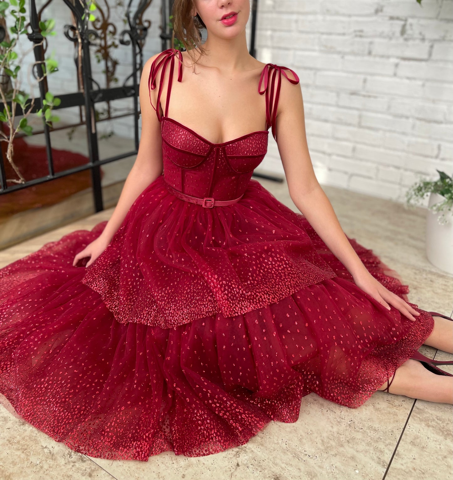 Red midi dress with spaghetti straps and belt