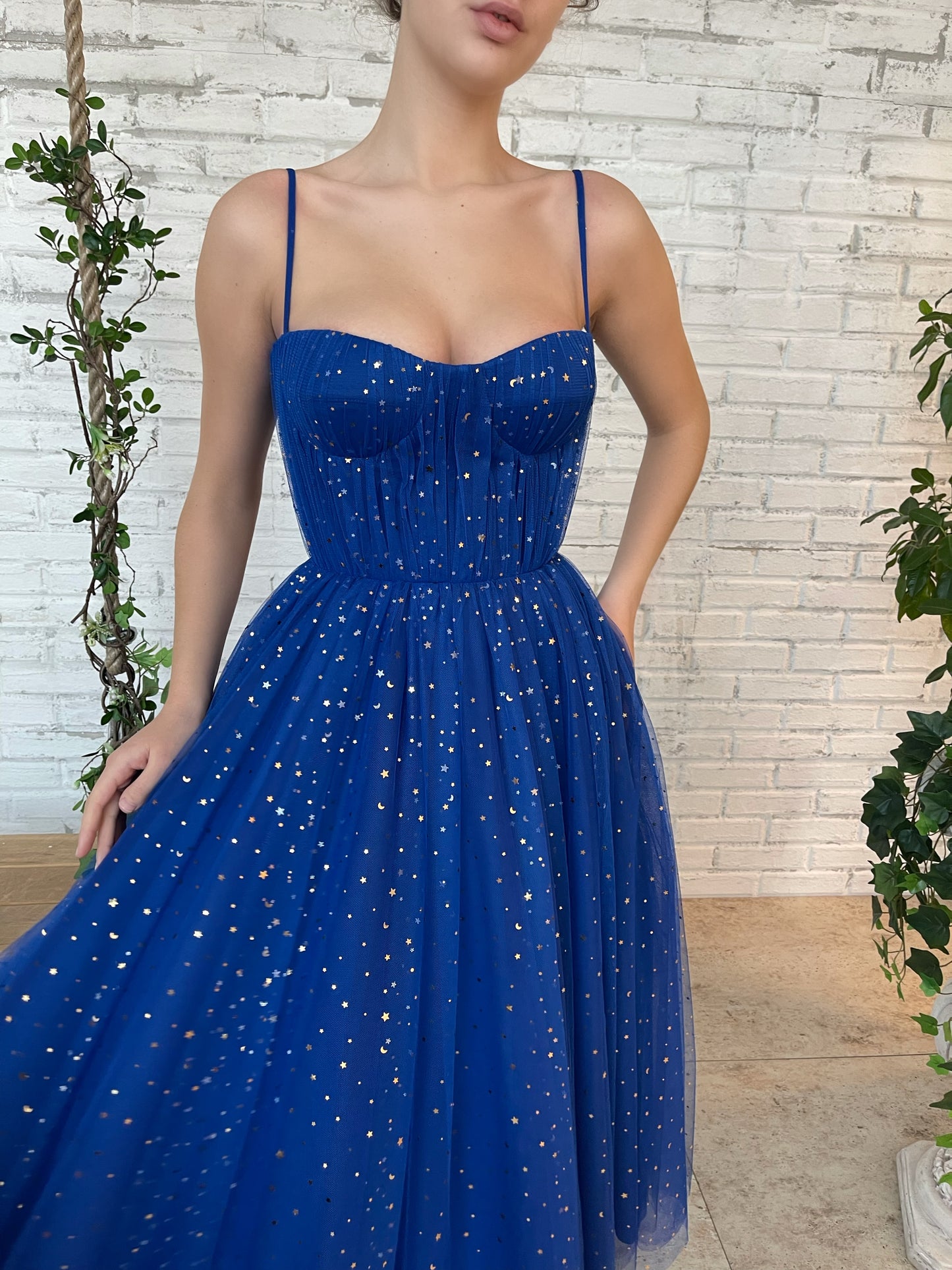 Blue midi dress with spaghetti straps and starry fabric