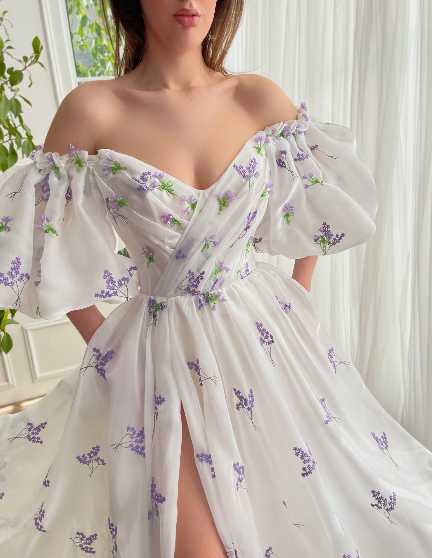 White A-Line dress with short off the shoulder sleeves and printed flowers