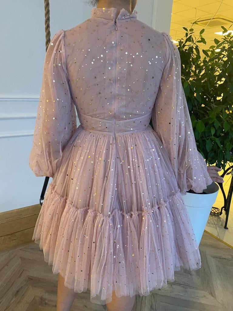 Pink mini dress with long sleeves and starry fabric