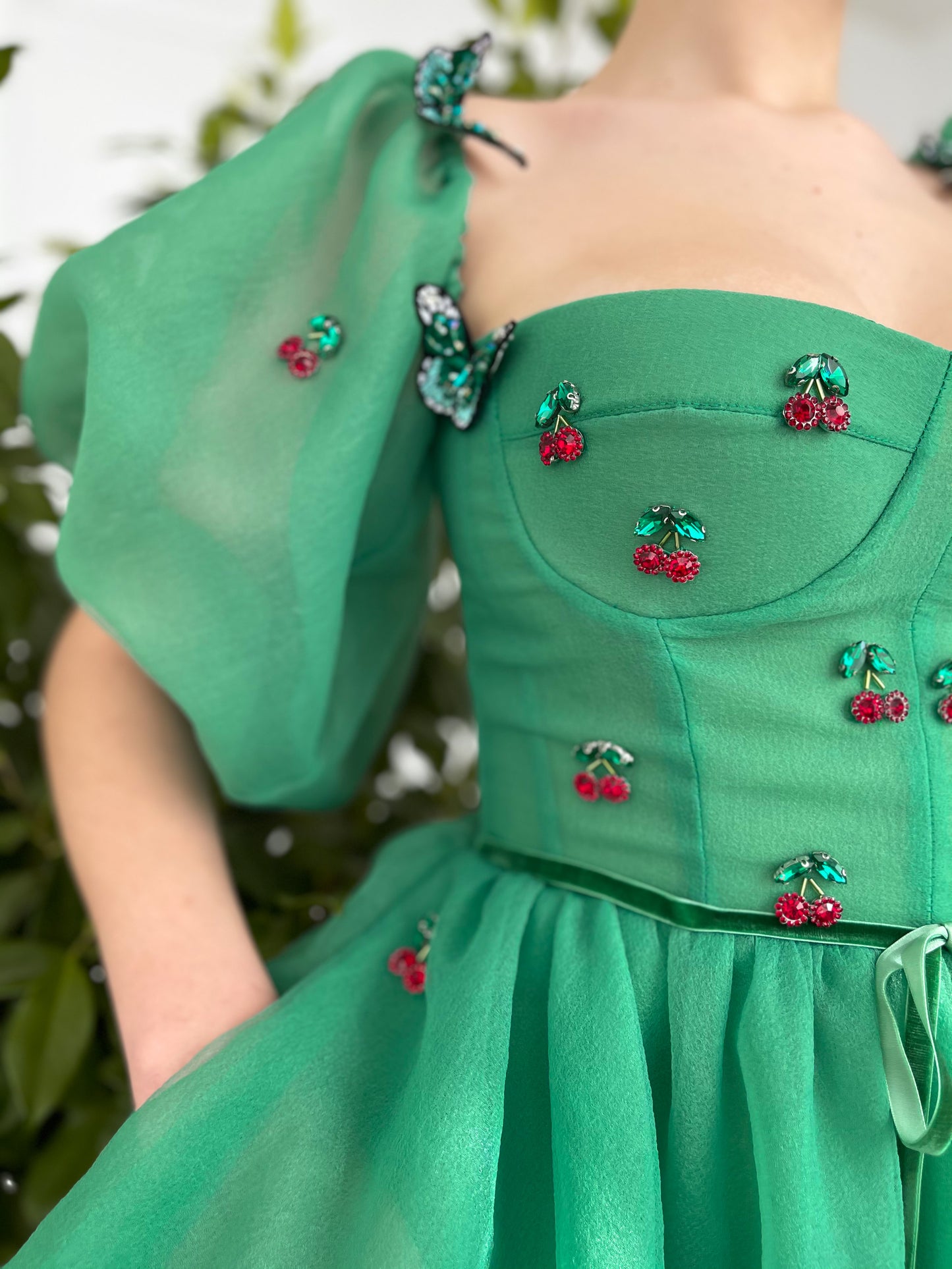Green mini dress with embroidered cherries, butterflies and off the shoulder sleeves 