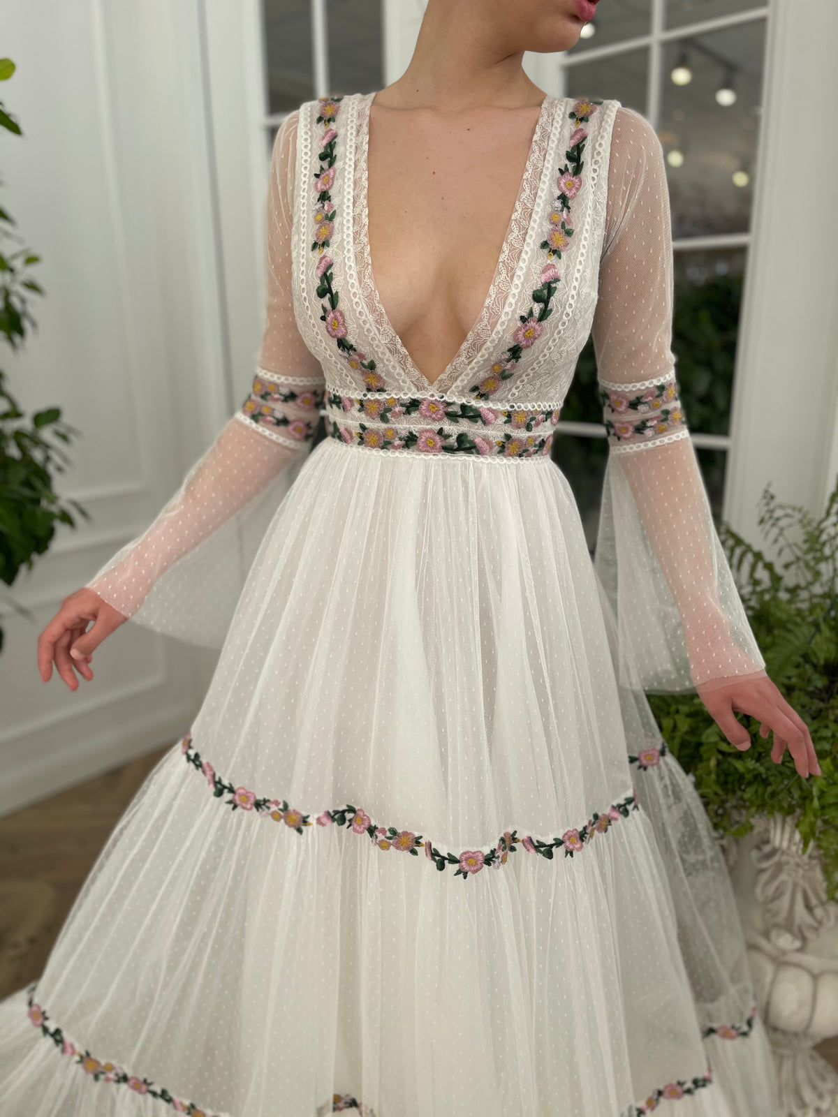 A Line white bridal dress with v-neck, long sleeves and embroidered flowers