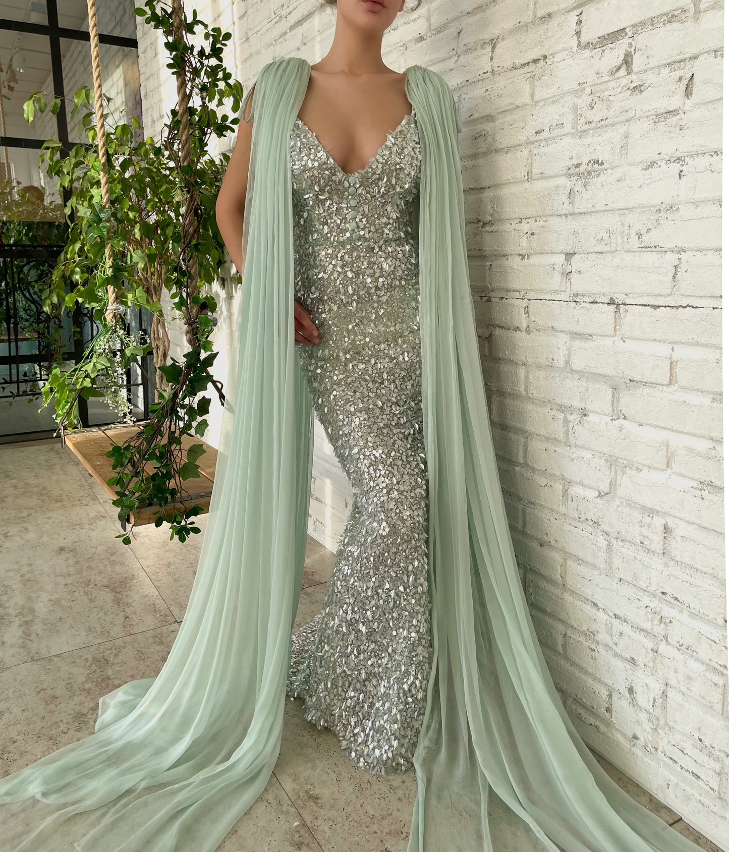 Green mermaid dress with cape sleeves and v-neck