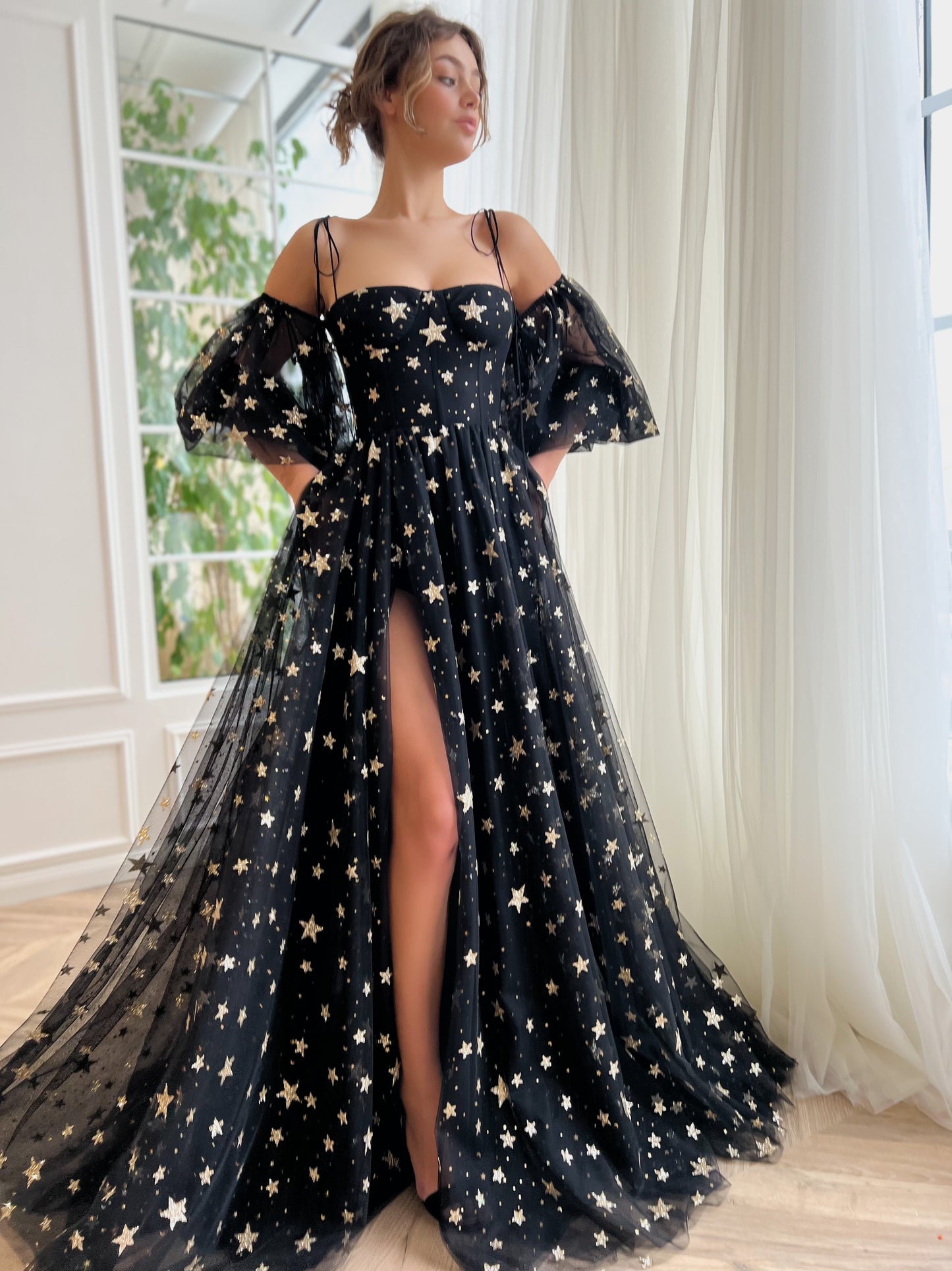 Black A-Line dress with spaghetti straps, off the shoulder sleeves and starry fabric