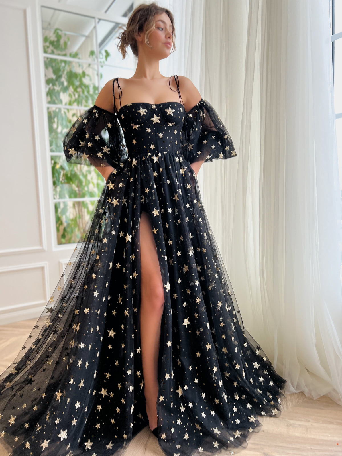 Black A-Line dress with spaghetti straps, off the shoulder sleeves and starry fabric