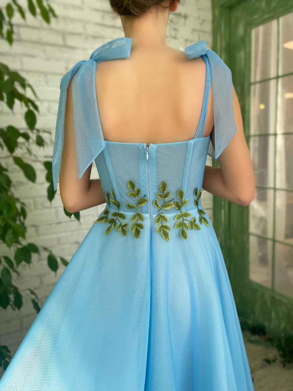 Blue midi dress with bow straps and embroidery