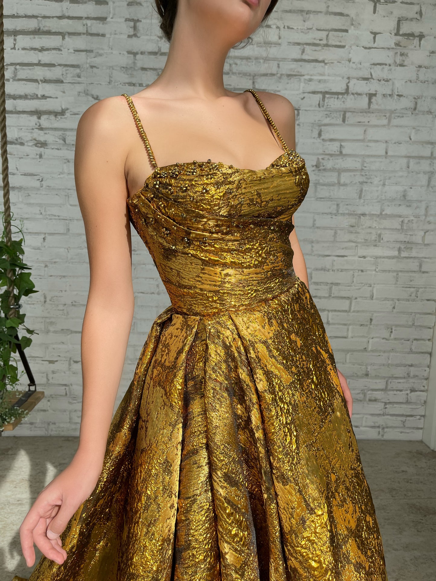 Gold A-Line dress with spaghetti straps and beading