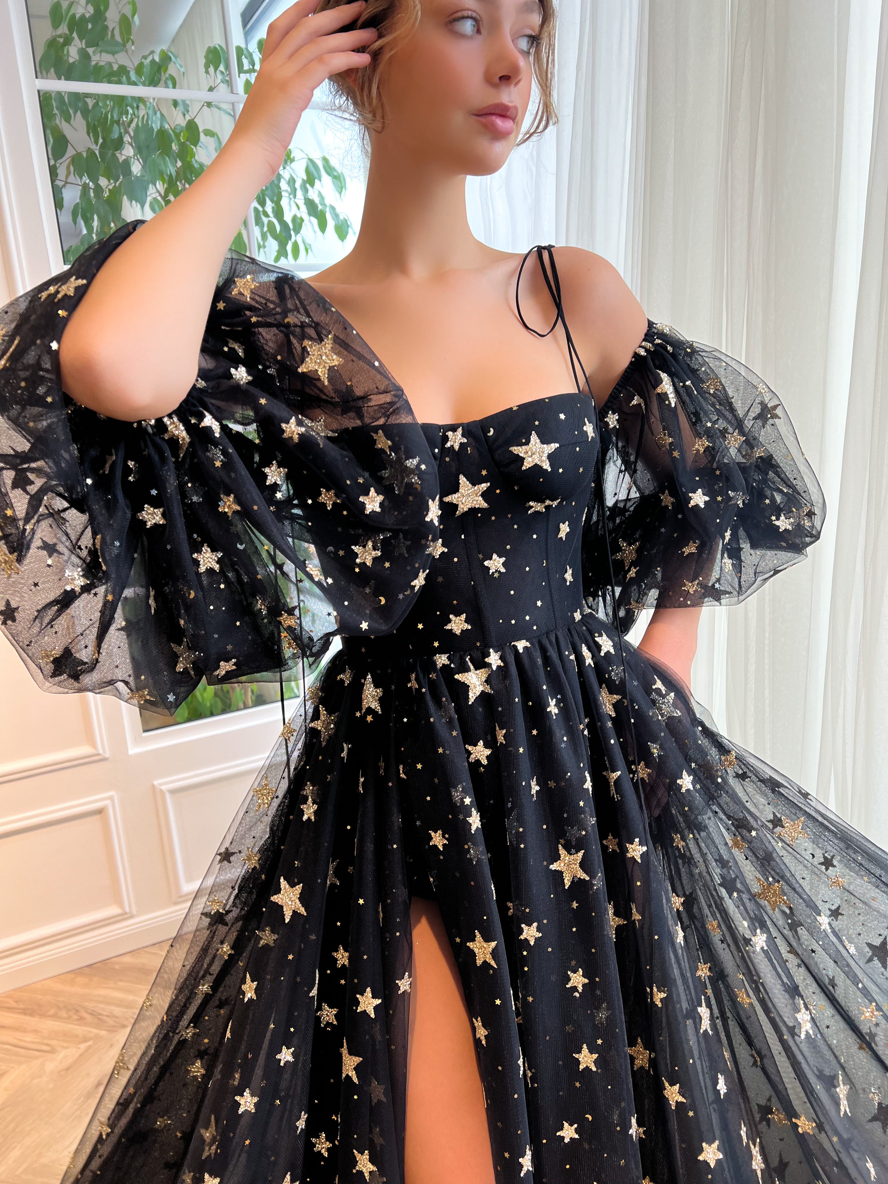 Black A-Line dress with spaghetti straps, off the shoulder sleeves and starry fabric