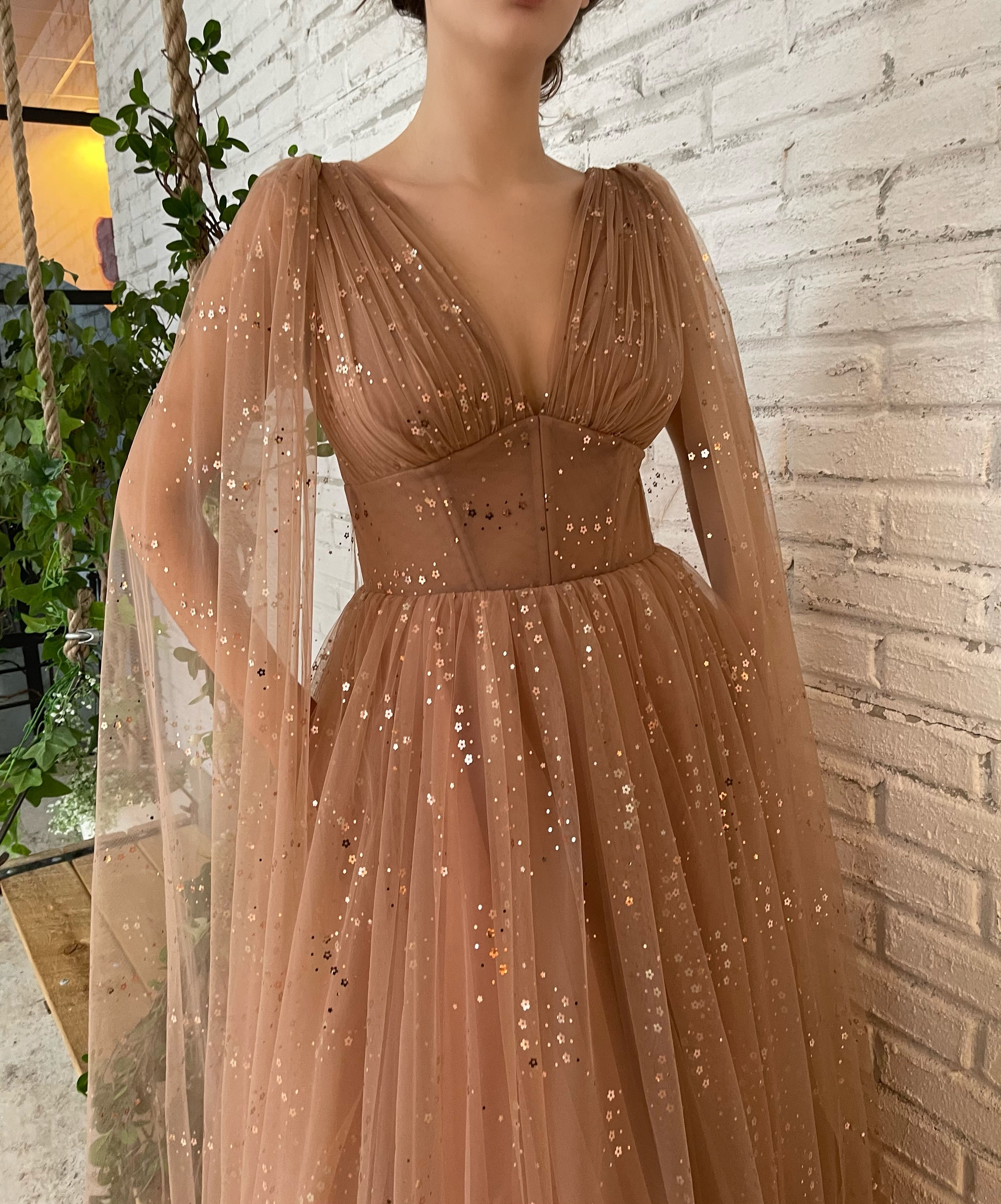 Brown A-Line dress with v-neck, cape sleeves and starry fabric