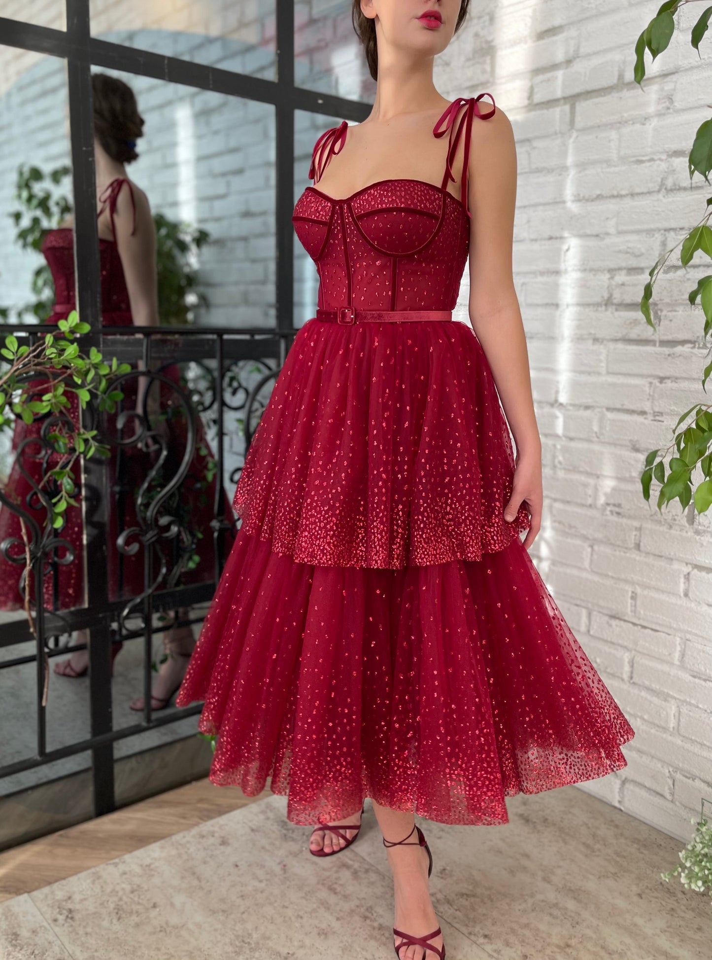 Red midi dress with spaghetti straps and belt