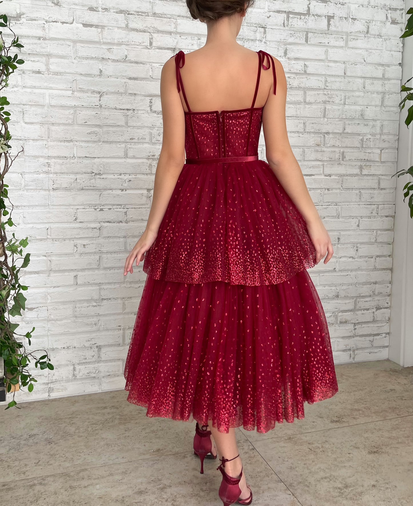 Red midi dress with spaghetti straps and belt