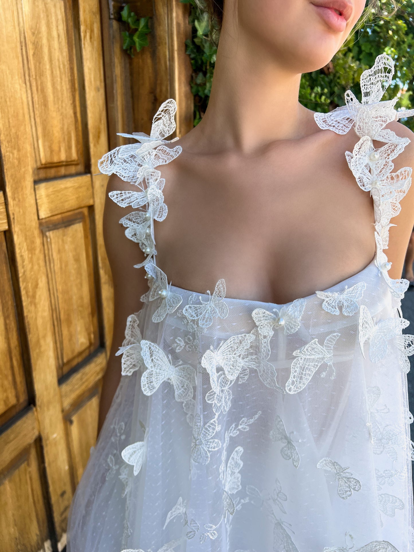 White mini dress with spaghetti straps, embroidery and butterflies