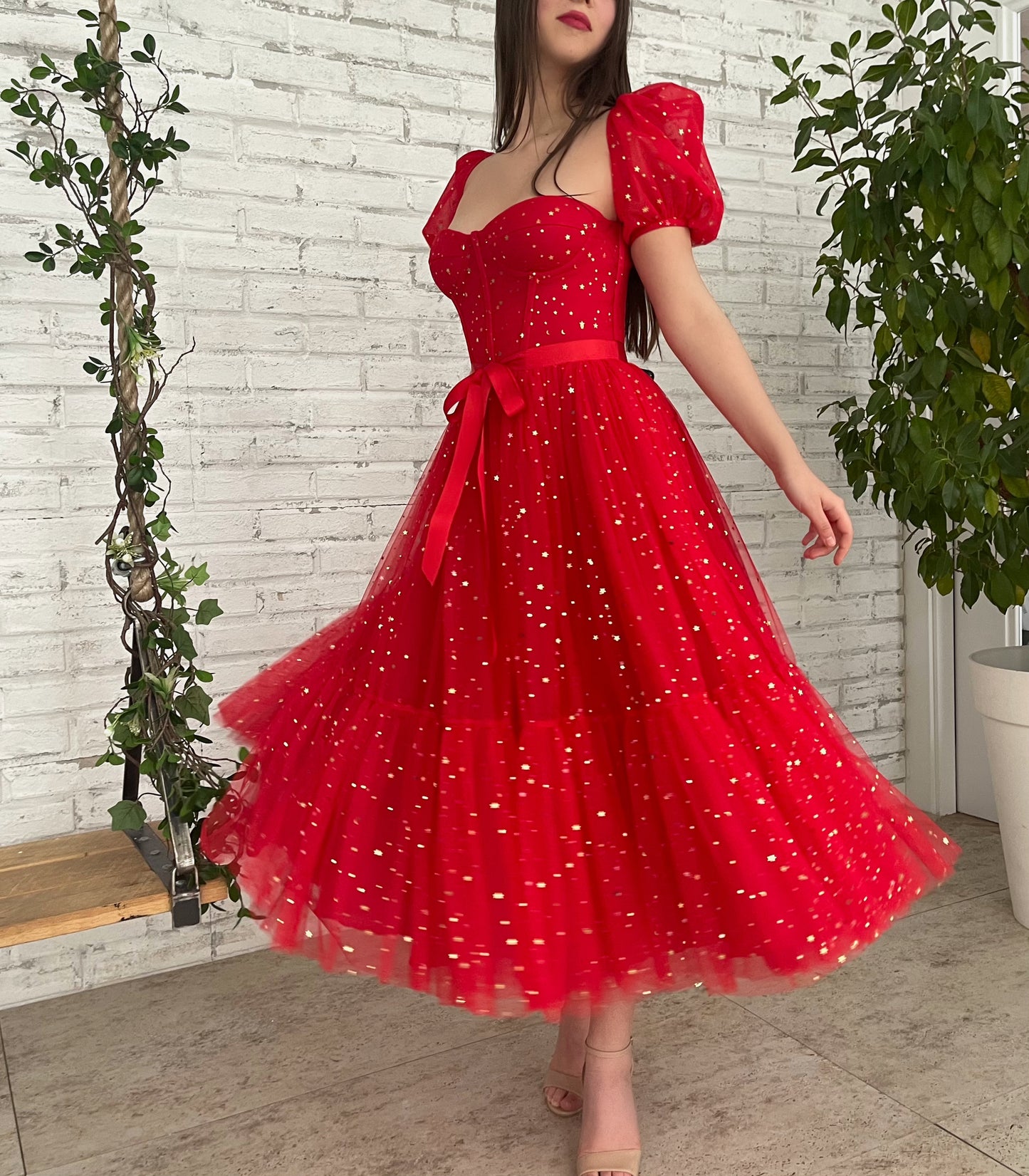 Red midi dress with short sleeves and starry fabric