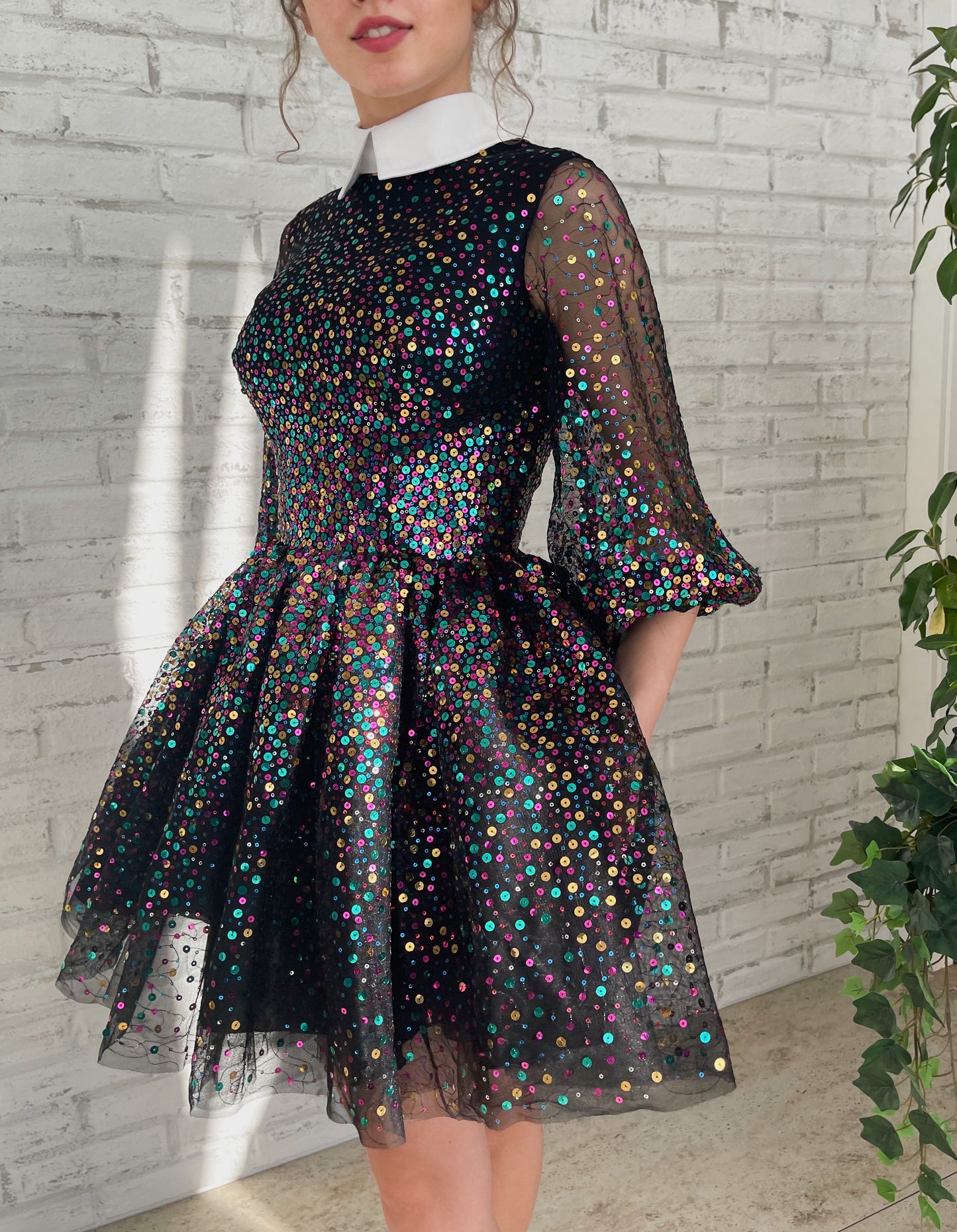 Black mini dress with sequins and short sleeves