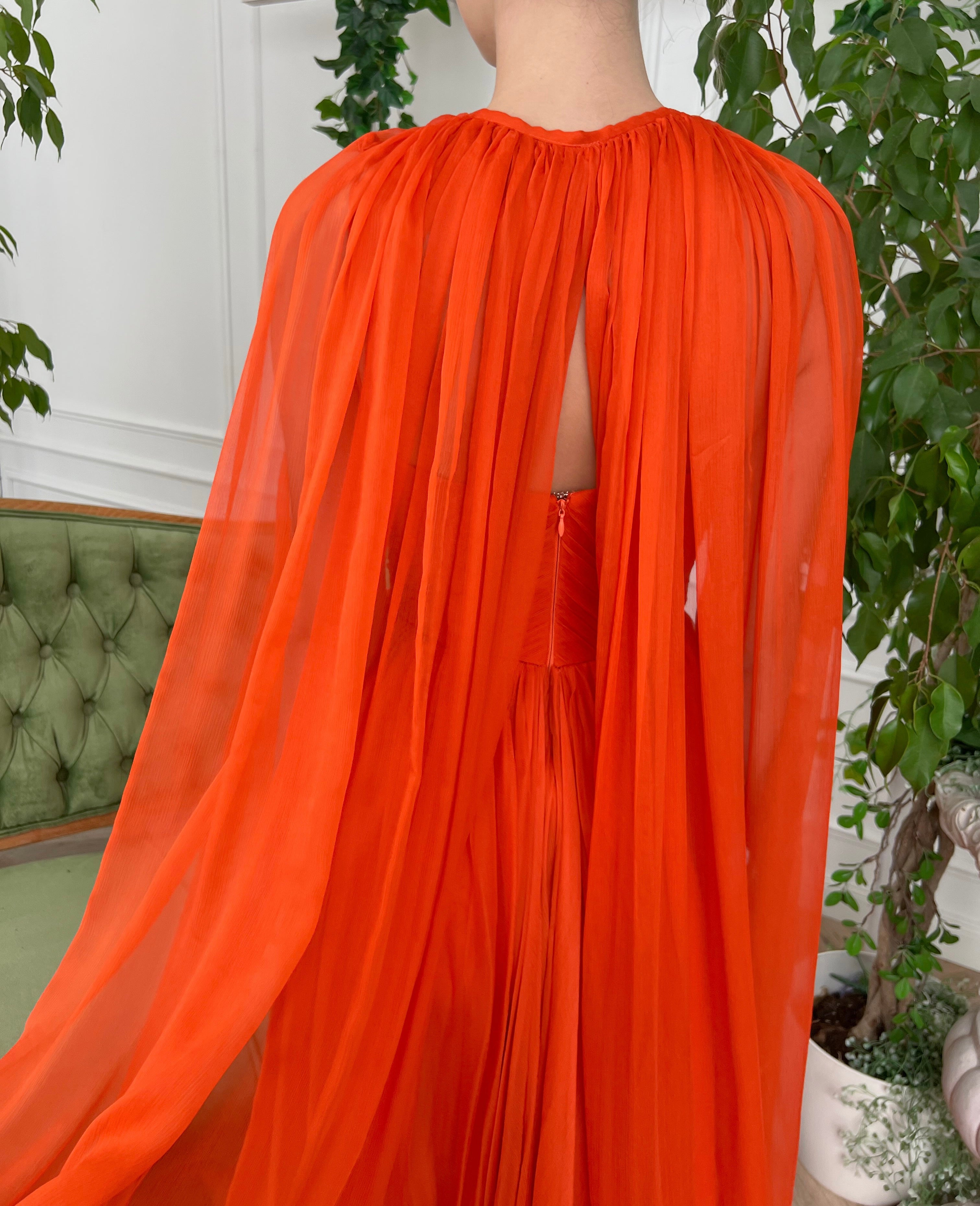 Orange A-Line dress with v-neck, no sleeves and cape
