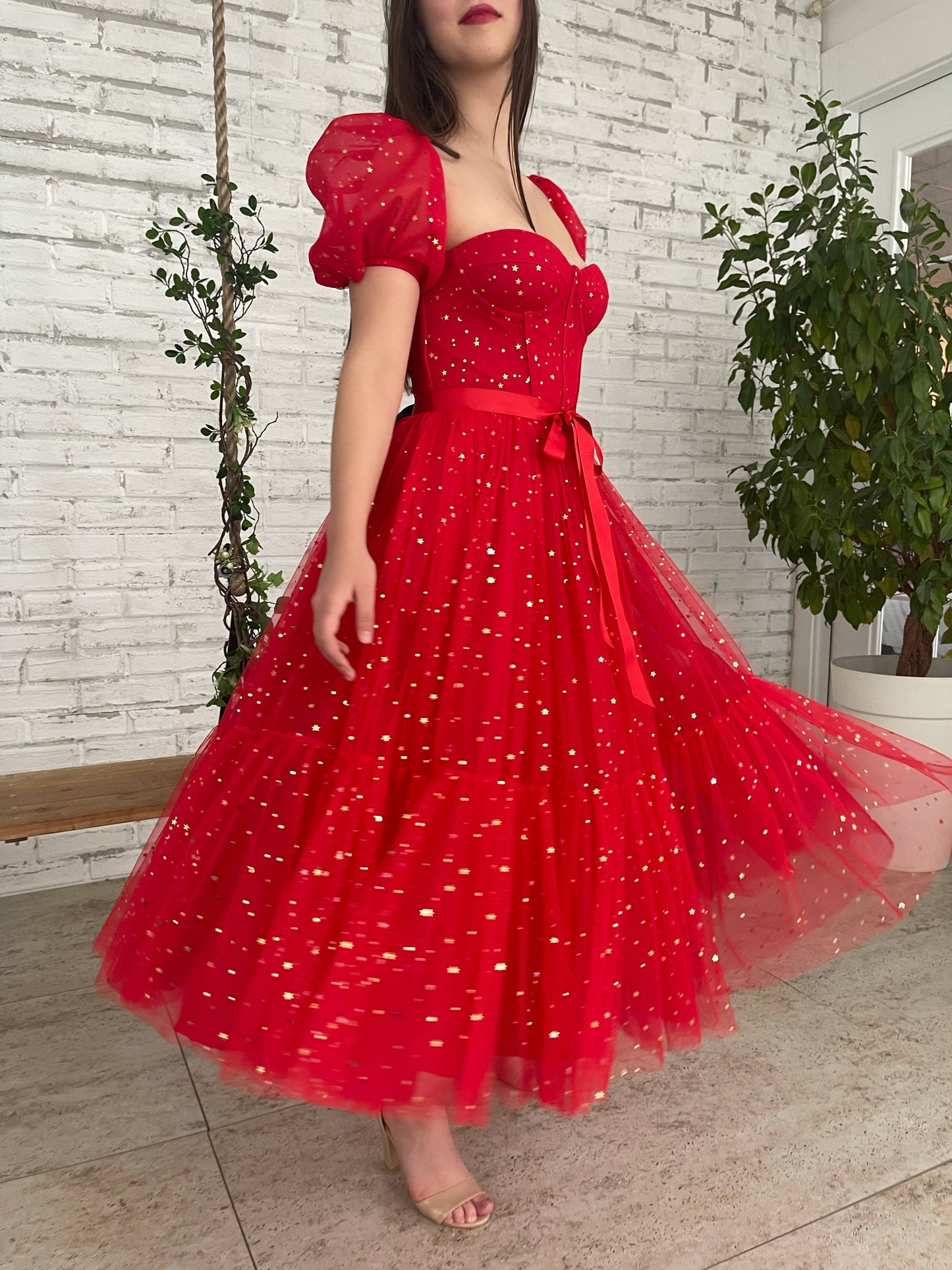 Red midi dress with short sleeves and starry fabric