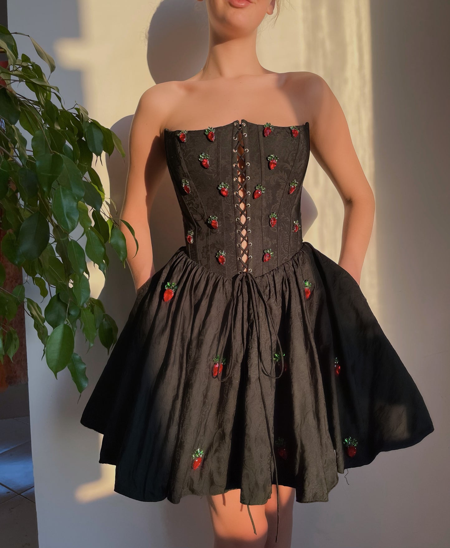 Black mini dress with no sleeves and embroidery