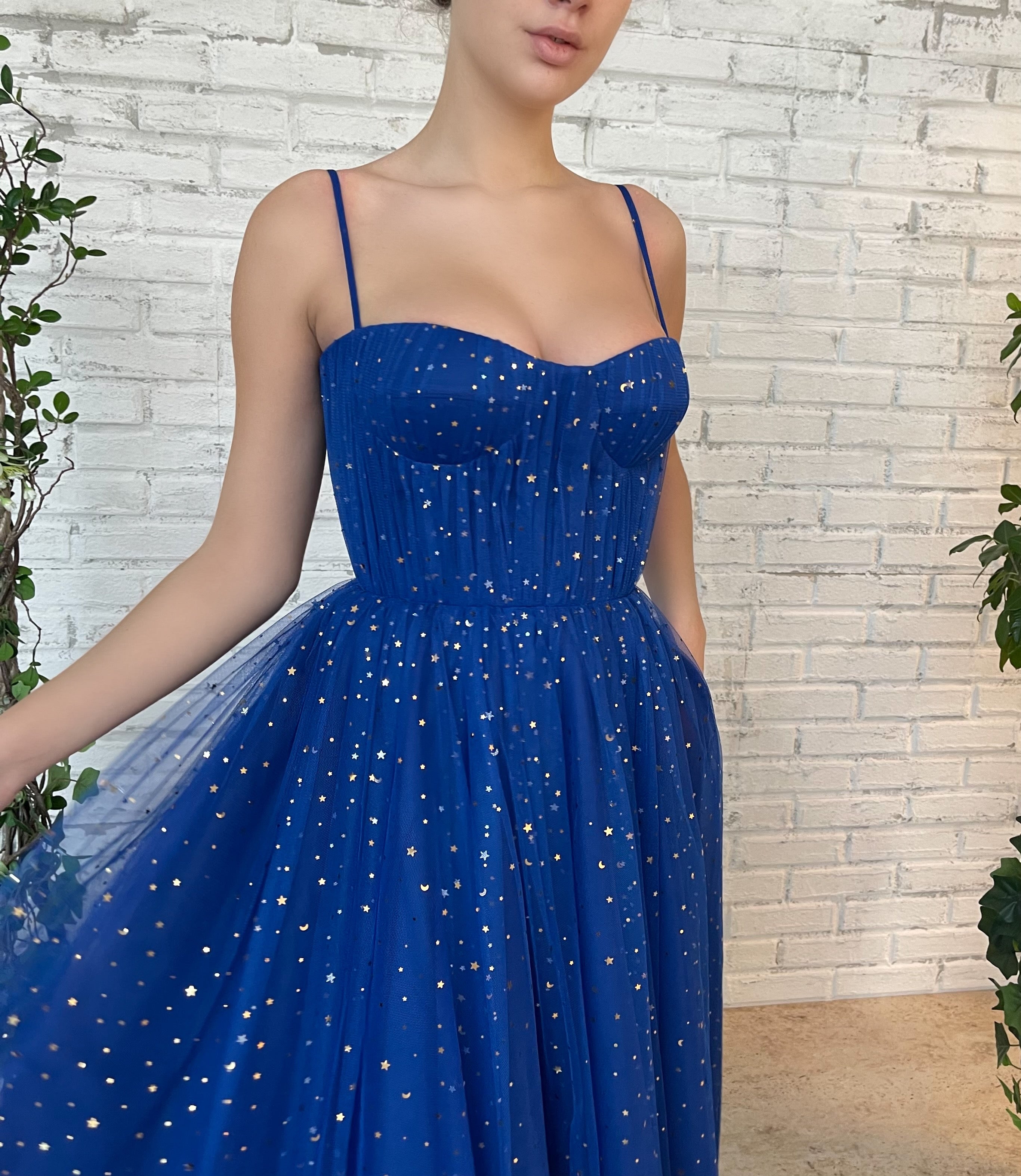 Blue midi dress with spaghetti straps and starry fabric