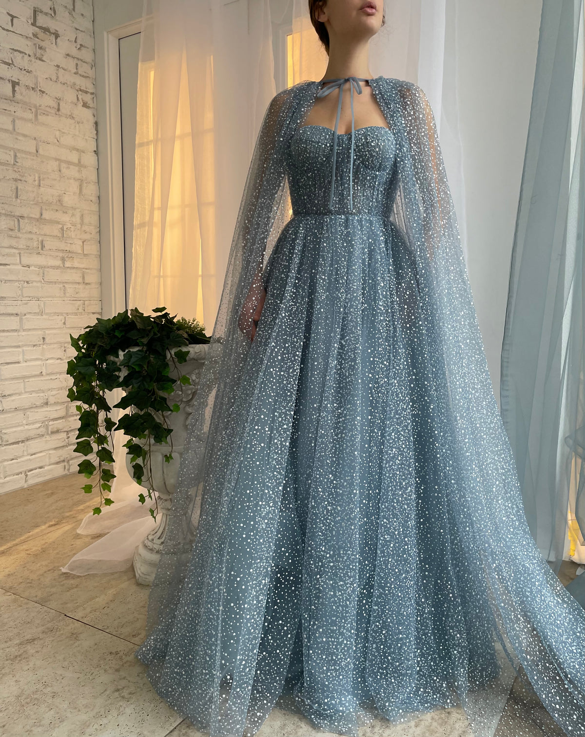 Blue A-Line dress with no sleeves and cape